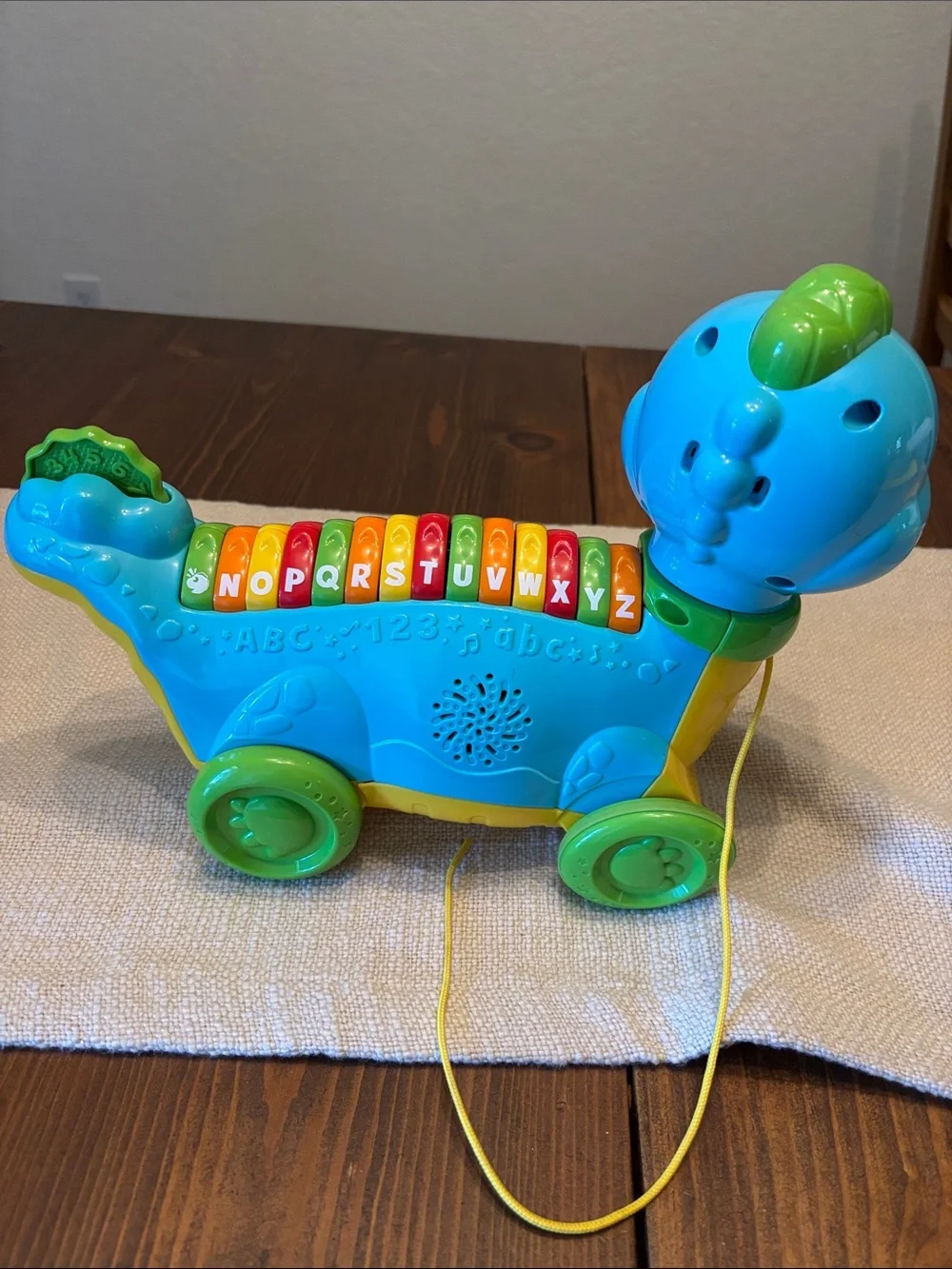 Leap Frog Lettersaurus alphabet pull along toy.